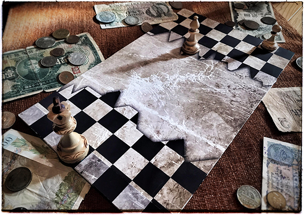 broken chess board with scattered money